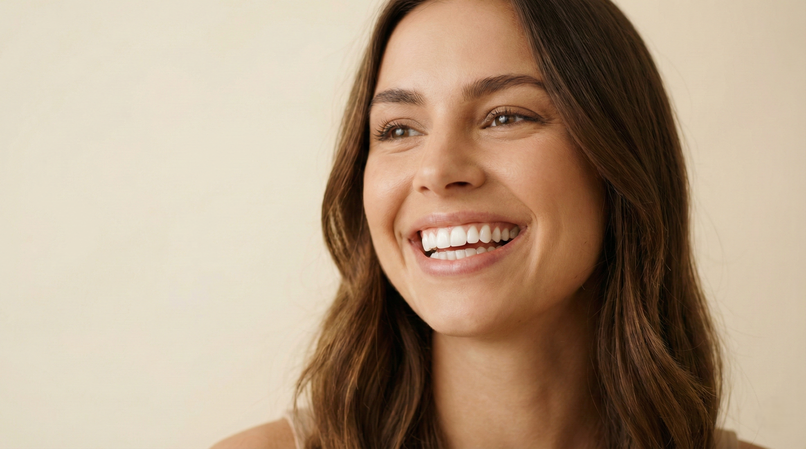 Woman with a confident smile showing beautiful natural-looking snap-on veneers